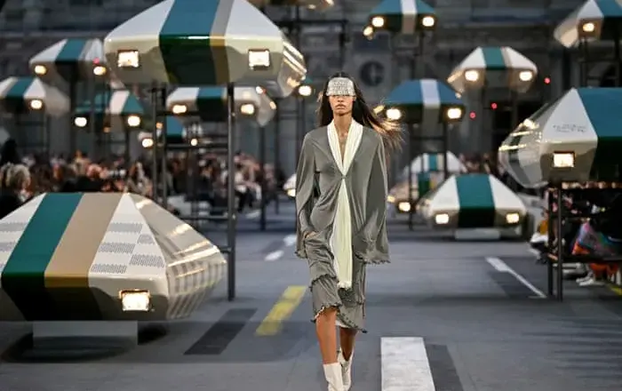 Louis Vuitton pairs lighter clothing with a futuristic Louvre setting