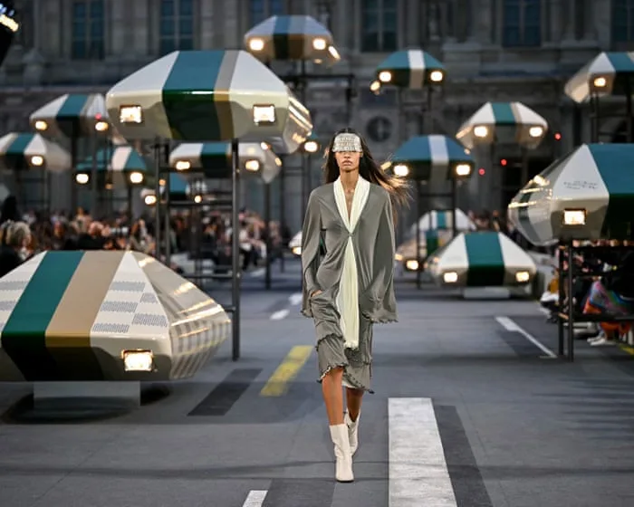 Louis Vuitton pairs lighter clothing with a futuristic Louvre setting